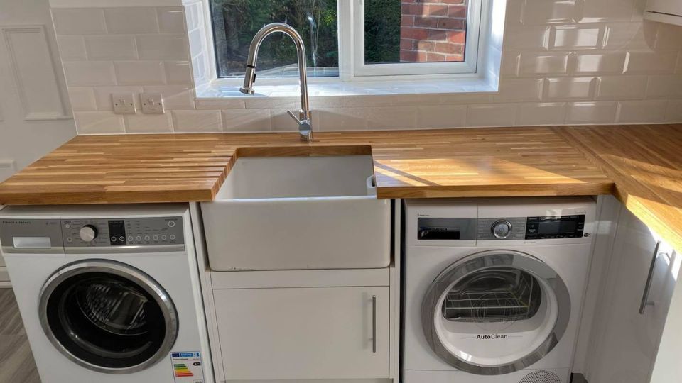 New kitchen butler sink, washing machine and tumble dryer fitted in a new kitchen in Portsmouth
